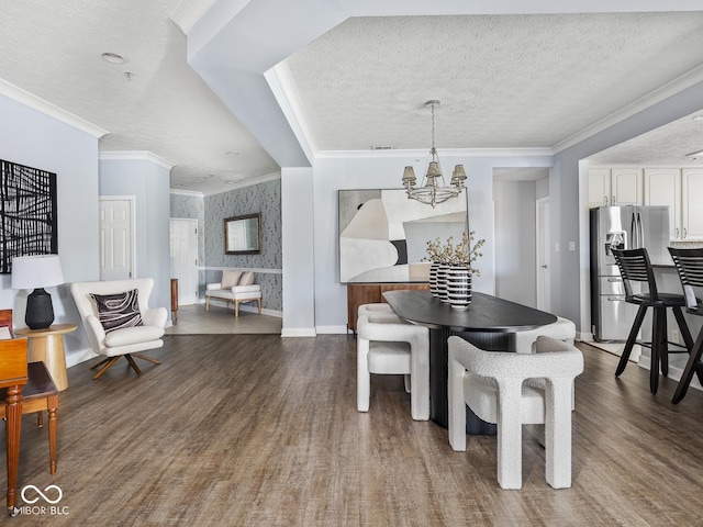 6730 Spirit Lake Dr Unit 202, Indianapolis, IN 46220 - dining room featuring wallpapered walls, dark wood-style floors, a chandelier, ornamental molding, and a textured ceiling