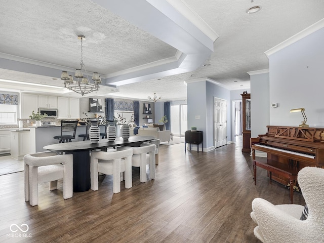 6730 Spirit Lake Dr Unit 202, Indianapolis, IN 46220 - dining room with a chandelier, a textured ceiling, crown molding, and wood finished floors