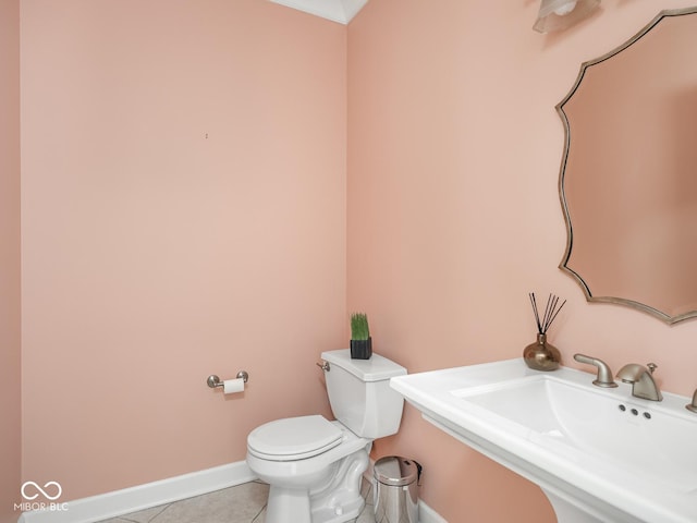 6730 Spirit Lake Dr Unit 202, Indianapolis, IN 46220 - half bath featuring a sink and tile patterned floors