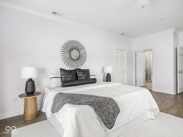 6730 Spirit Lake Dr Unit 202, Indianapolis, IN 46220 - bedroom featuring ornamental molding and wood finished floors