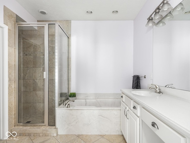 6730 Spirit Lake Dr Unit 202, Indianapolis, IN 46220 - full bath with vanity, a garden tub, tile patterned flooring, and a shower stall