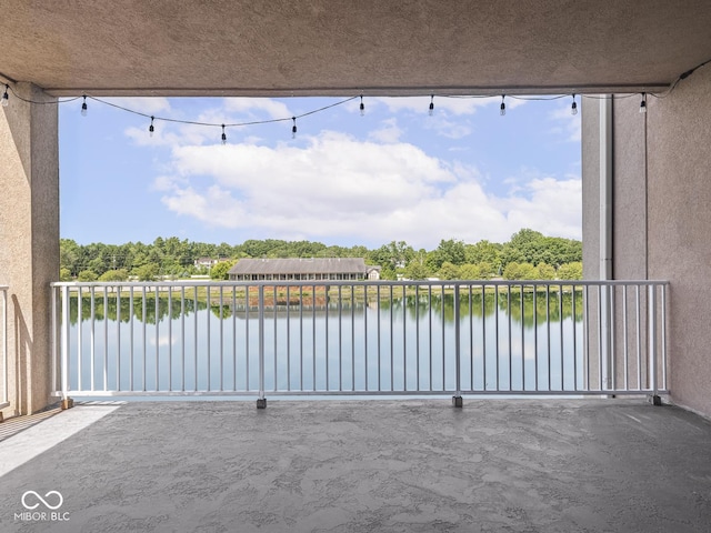 6730 Spirit Lake Dr Unit 202, Indianapolis, IN 46220 - patio / terrace featuring a water view and view of wooded area