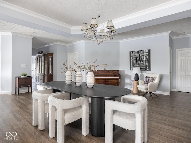 6730 Spirit Lake Dr Unit 202, Indianapolis, IN 46220 - dining area with a chandelier, a textured ceiling, dark wood finished floors, ornamental molding, and a tray ceiling