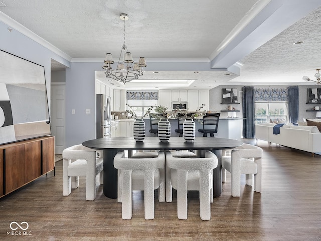 6730 Spirit Lake Dr Unit 202, Indianapolis, IN 46220 - dining space with ornamental molding, a chandelier, a textured ceiling, and wood finished floors