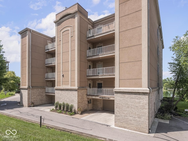 6730 Spirit Lake Dr Unit 202, Indianapolis, IN 46220 - view of apartment building / complex with a garage