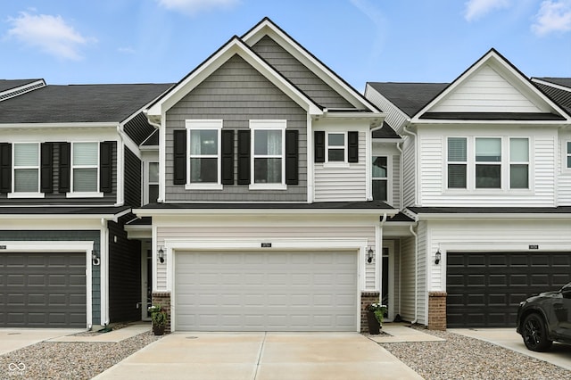 18750 Terra Vis Pl, Westfield, IN 46074 - view of property with an attached garage, driveway, and brick siding