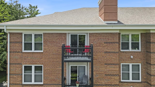 8650 Jaffa Ct W Drive 32, Indianapolis, IN 46260 - view of side of property with a balcony and brick siding