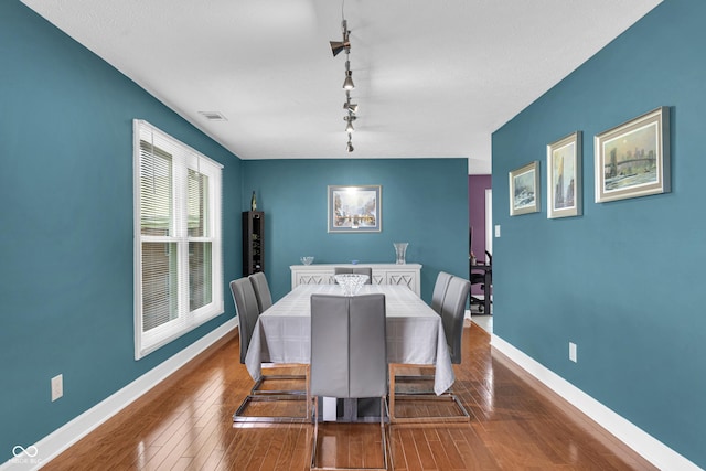 8650 Jaffa Ct W Drive 32, Indianapolis, IN 46260 - dining room featuring wood finished floors and rail lighting