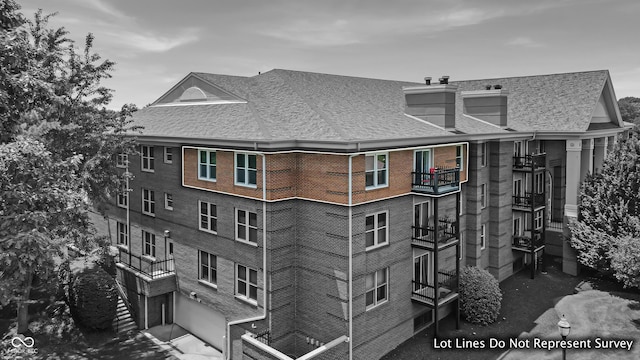 8650 Jaffa Ct W Drive 32, Indianapolis, IN 46260 - view of apartment building / complex featuring an attached garage