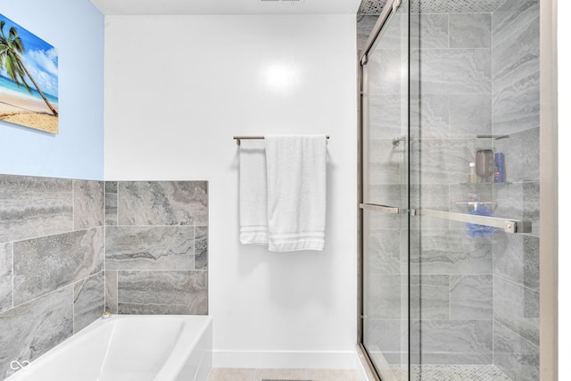 8650 Jaffa Ct W Drive 32, Indianapolis, IN 46260 - bathroom featuring a bath and a shower stall