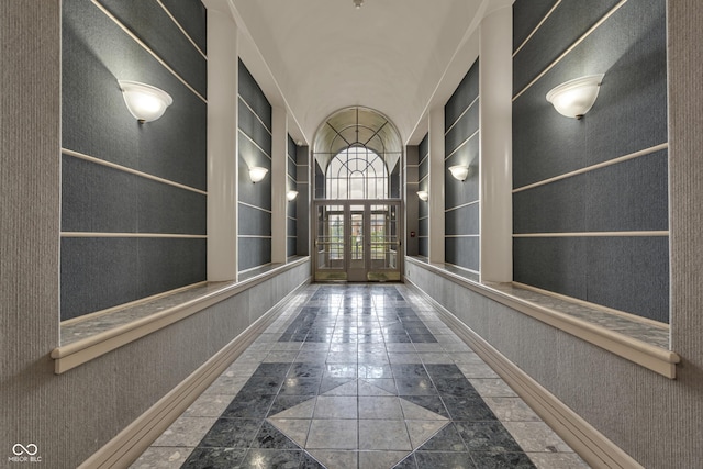 8650 Jaffa Ct W Drive 32, Indianapolis, IN 46260 - hall featuring inlaid floor details, french doors, and built in features