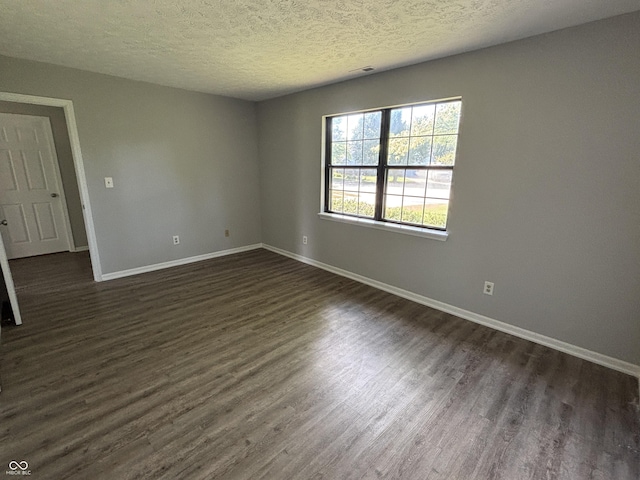 7313 Shanna Cir, Indianapolis, IN 46236 - unfurnished room with dark wood finished floors and a textured ceiling