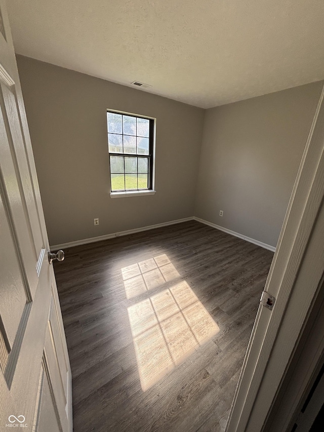 7313 Shanna Cir, Indianapolis, IN 46236 - unfurnished room featuring dark wood-style floors and a textured ceiling