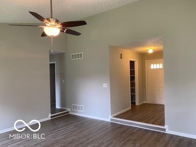 7313 Shanna Cir, Indianapolis, IN 46236 - unfurnished room featuring a ceiling fan, wood finished floors, high vaulted ceiling, and a textured ceiling