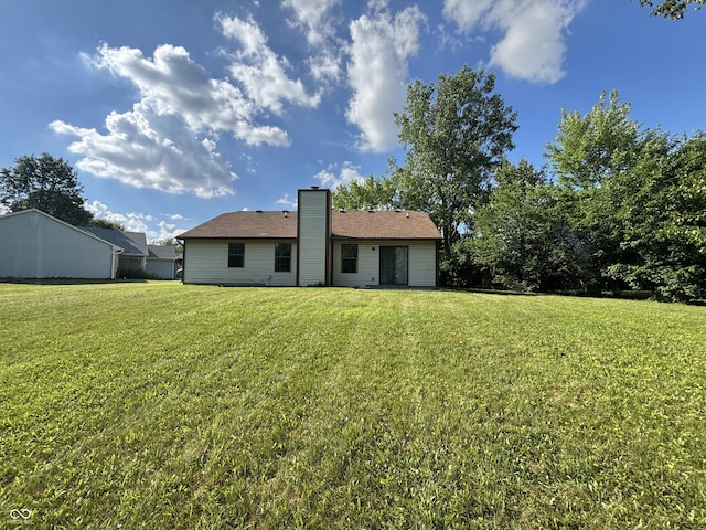 7313 Shanna Cir, Indianapolis, IN 46236 - back of property featuring a yard and a chimney