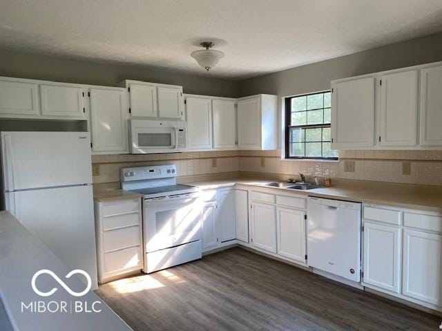 7313 Shanna Cir, Indianapolis, IN 46236 - kitchen with white appliances, white cabinetry, decorative backsplash, dark wood-type flooring, and light countertops