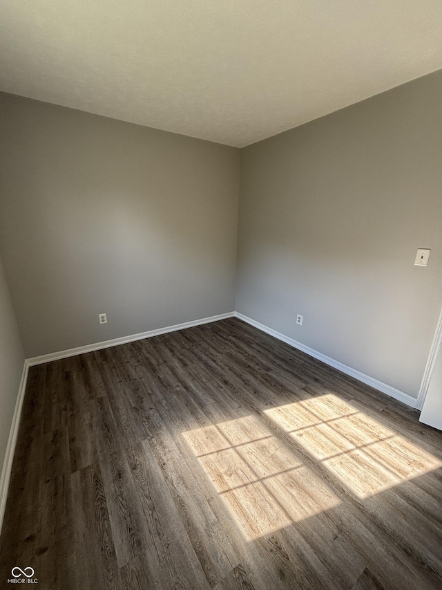 7313 Shanna Cir, Indianapolis, IN 46236 - empty room with dark wood finished floors and baseboards