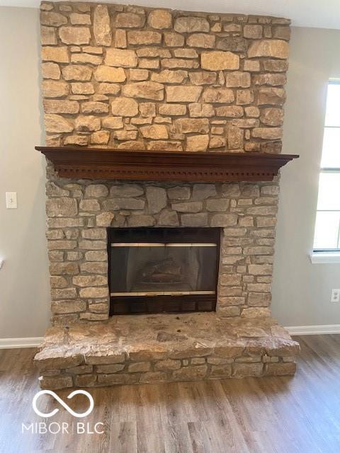 7313 Shanna Cir, Indianapolis, IN 46236 - detailed view of wood finished floors and a stone fireplace