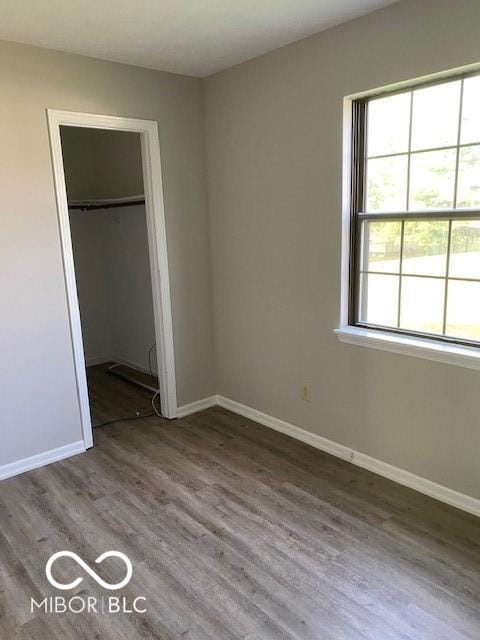 7313 Shanna Cir, Indianapolis, IN 46236 - unfurnished bedroom featuring wood finished floors and a closet