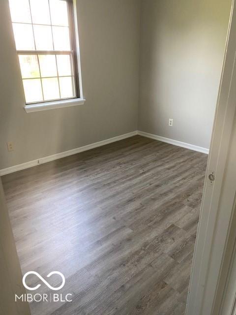 7313 Shanna Cir, Indianapolis, IN 46236 - empty room featuring baseboards and wood finished floors
