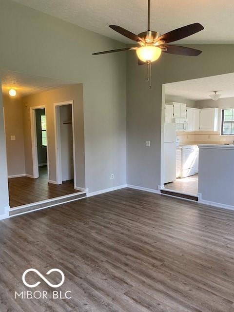 7313 Shanna Cir, Indianapolis, IN 46236 - unfurnished living room with a ceiling fan, wood finished floors, and lofted ceiling