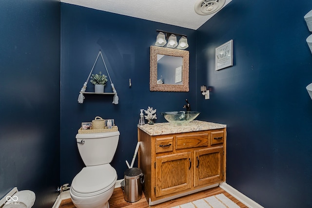 1616 Beech Cir, Plainfield, IN 46168 - bathroom featuring vanity, wood finished floors, and a baseboard heating unit