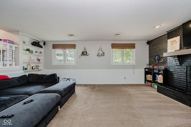 1616 Beech Cir, Plainfield, IN 46168 - carpeted living area with healthy amount of natural light, wooden walls, and wainscoting