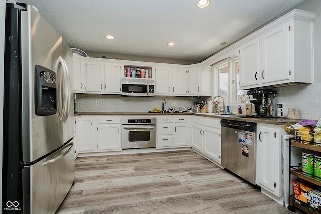 1616 Beech Cir, Plainfield, IN 46168 - kitchen with stainless steel appliances, white cabinetry, backsplash, and recessed lighting