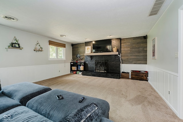 1616 Beech Cir, Plainfield, IN 46168 - carpeted living area featuring a fireplace and wainscoting
