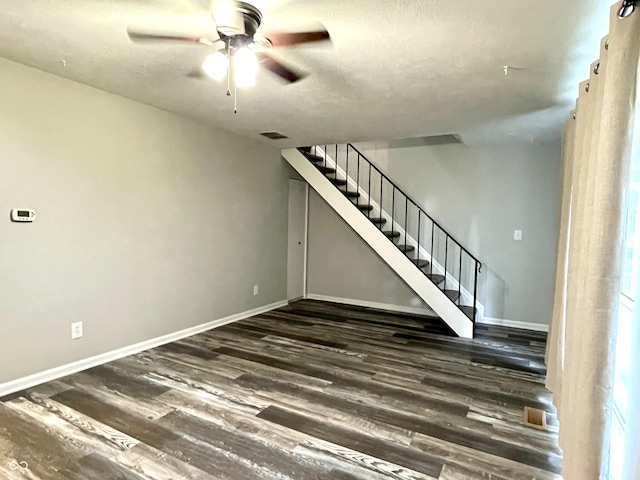 4933 Oakwood Trl, Indianapolis, IN 46268 - unfurnished living room with a ceiling fan, stairway, and wood finished floors