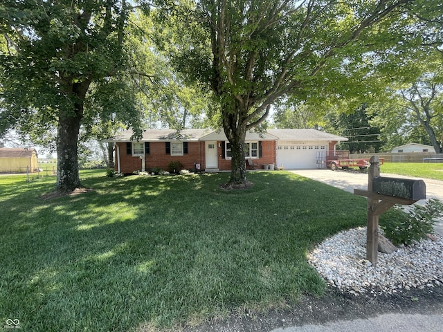 9783 Lee Ct, Columbus, IN 47203 - single story home with an attached garage, driveway, and brick siding