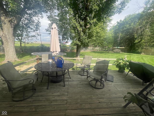 9783 Lee Ct, Columbus, IN 47203 - deck featuring outdoor dining area and a fenced backyard
