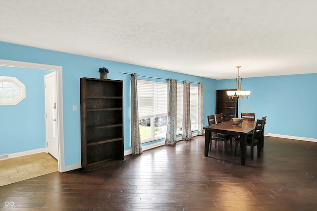 125 E Waterbury Rd, Indianapolis, IN 46227 - dining room featuring a chandelier, dark wood-type flooring, and a textured ceiling