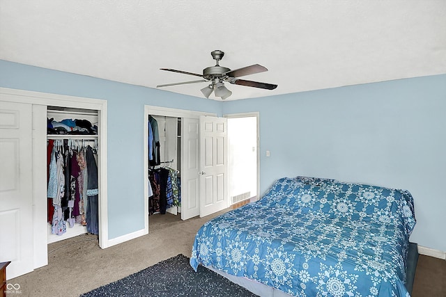 125 E Waterbury Rd, Indianapolis, IN 46227 - carpeted bedroom with multiple closets and a ceiling fan
