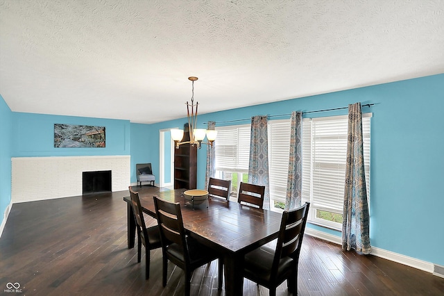 125 E Waterbury Rd, Indianapolis, IN 46227 - dining space with a chandelier, wood-type flooring, a textured ceiling, and a brick fireplace