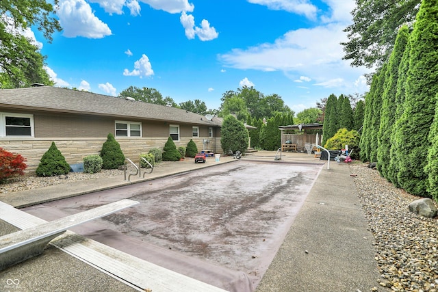 125 E Waterbury Rd, Indianapolis, IN 46227 - exterior space featuring stone siding and a patio area