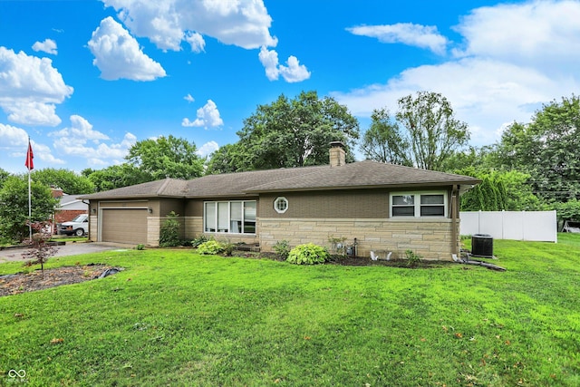 125 E Waterbury Rd, Indianapolis, IN 46227 - view of front of property with stone siding, an attached garage, driveway, and a chimney