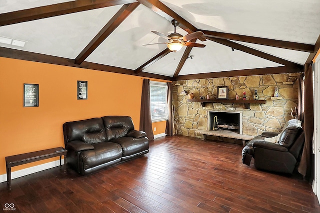 125 E Waterbury Rd, Indianapolis, IN 46227 - living area featuring beamed ceiling, ceiling fan, wood finished floors, a stone fireplace, and high vaulted ceiling