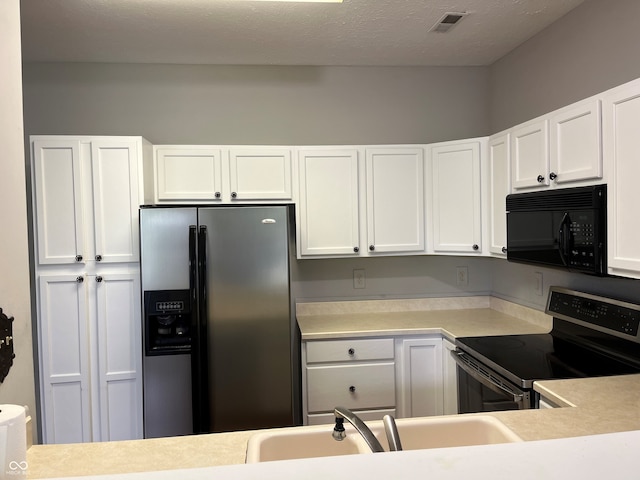 11332 Fonthill Dr, Indianapolis, IN 46236 - kitchen featuring appliances with stainless steel finishes, light countertops, and white cabinets