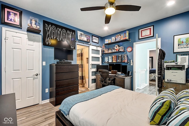 1551 N Park Ave, Indianapolis, IN 46202 - bedroom with light wood-style flooring, a desk, and a ceiling fan