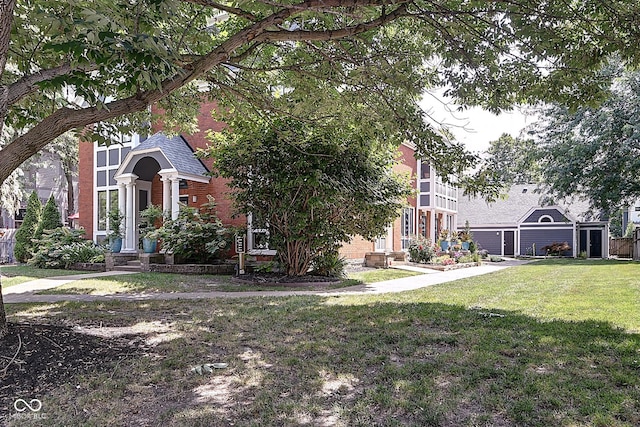 1551 N Park Ave, Indianapolis, IN 46202 - view of front of home featuring a front lawn, roof with shingles, and brick siding