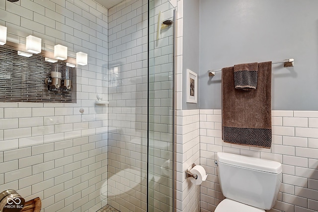 1551 N Park Ave, Indianapolis, IN 46202 - bathroom with a shower stall, a wainscoted wall, and tile walls