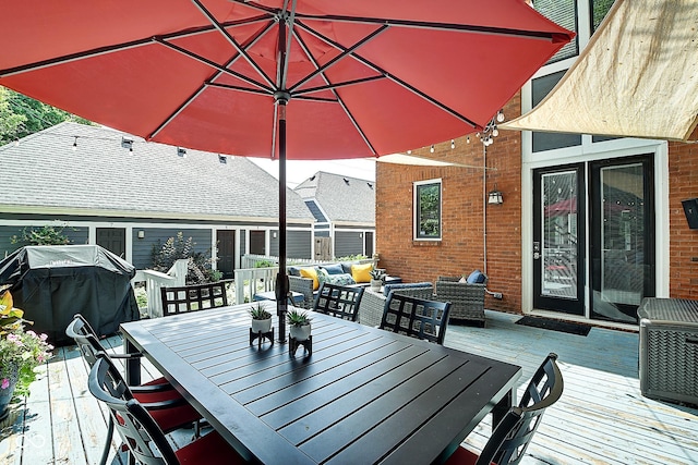 1551 N Park Ave, Indianapolis, IN 46202 - wooden deck with outdoor dining space, grilling area, and an outdoor living space