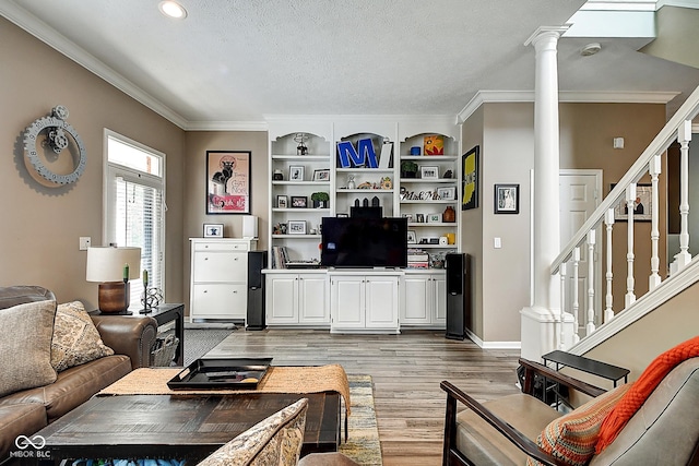 1551 N Park Ave, Indianapolis, IN 46202 - living room with ornate columns, light wood-type flooring, stairs, ornamental molding, and recessed lighting