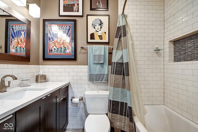 1551 N Park Ave, Indianapolis, IN 46202 - bathroom with vanity, shower / bath combo, and tile walls