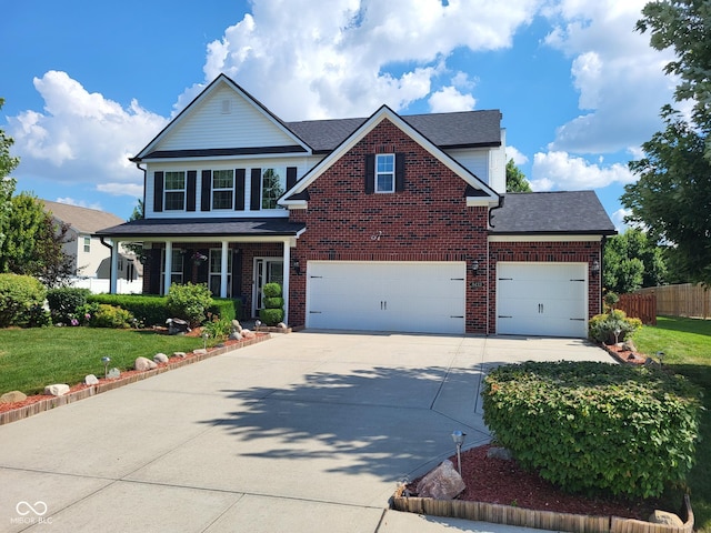 8433 Vyners Ln, Avon, IN 46123 - traditional-style home featuring concrete driveway, brick siding, covered porch, a garage, and roof with shingles