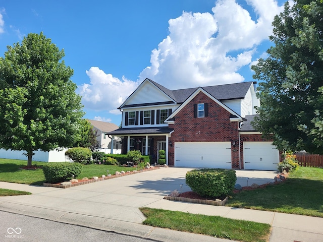 8433 Vyners Ln, Avon, IN 46123 - traditional-style house with brick siding, concrete driveway, and a garage