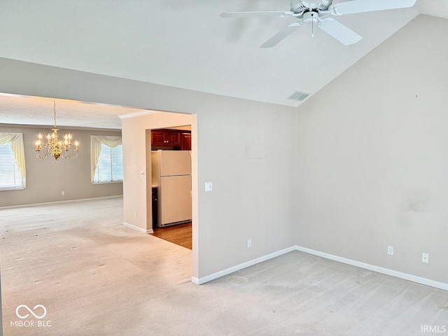 3400 W Riggin Rd, Muncie, IN 47304 - empty room with light carpet, a chandelier, ceiling fan, and vaulted ceiling