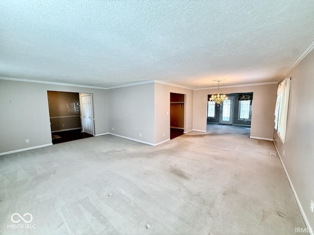 3400 W Riggin Rd, Muncie, IN 47304 - unfurnished living room featuring a chandelier, a textured ceiling, ornamental molding, and carpet floors