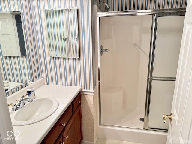 3400 W Riggin Rd, Muncie, IN 47304 - bathroom featuring wallpapered walls, a shower stall, and vanity